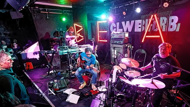 Beak> performing at Clwb Ifor Bach in Cardiff in 2024.