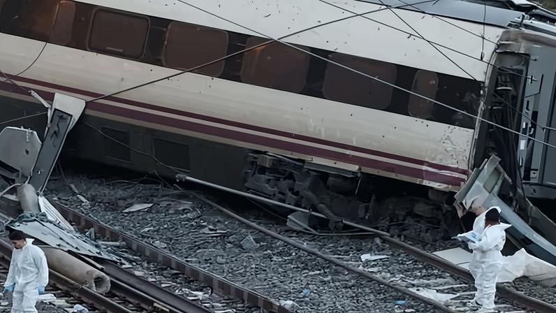 Members of the Spanish Civil Guard crime department work next to the trains involved in the accident