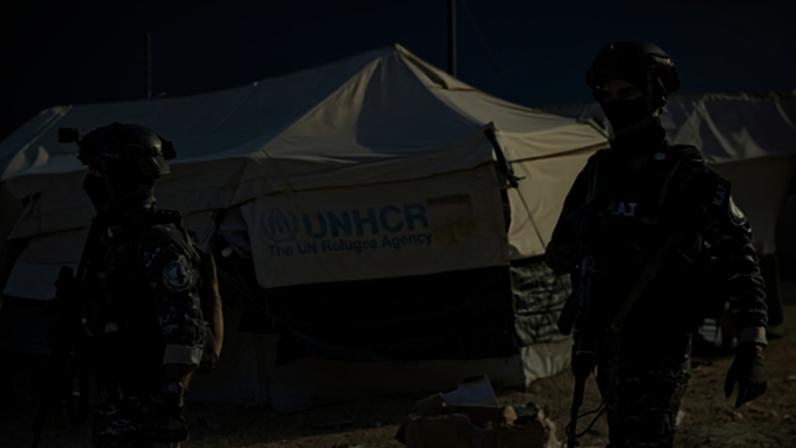 Soldiers patrol the Kurdish-run al-Hol camp in 2022. It houses among others, the most radical of foreign women suspected to have been members of IS, and their families.