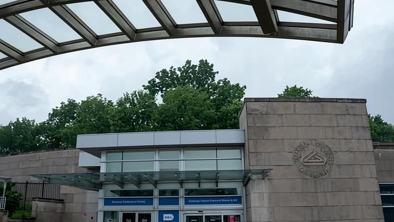 The National Institutes of Health (NIH) Gateway Center is seen in the rain in Bethesda, Maryland, on 8 June 2025.
