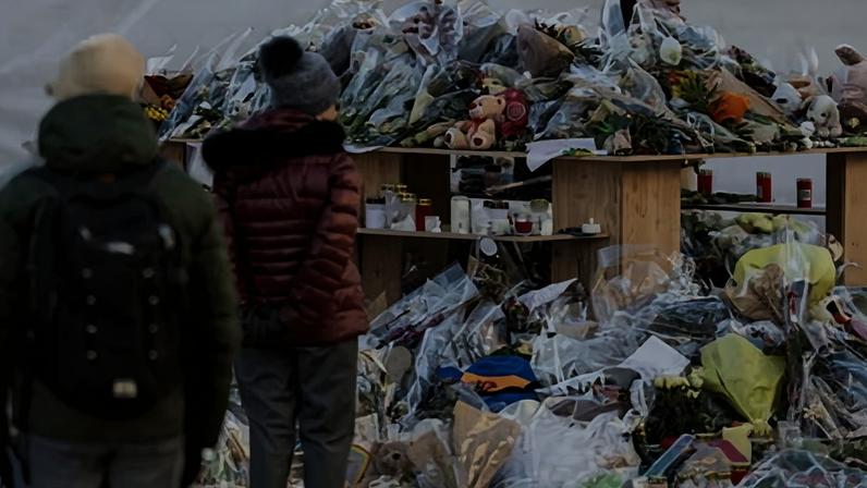 Flowers and candles left in tribute to the victims after the fire at 'Le Constellation bar in Crans-Montana, Switzerland.