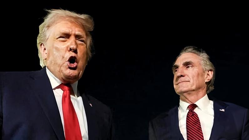 US President Donald Trump speaks to members of the media, alongside Secretary of the Interior Doug Burgum, ahead of boarding Air Force One to depart for Washington