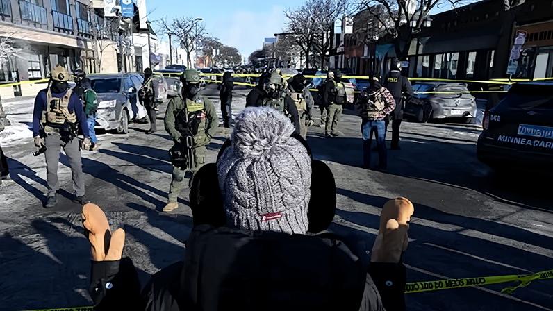 Federal agents block off the scene of a shooting as crowds gather on 24 January 2026 in Minneapolis, Minnesota.