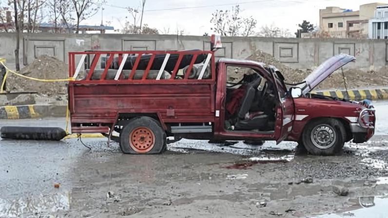 A damaged vehicle is pictured near a blast site after an attack by Baloch insurgents in Quetta in the province of Balochistan on Saturday.