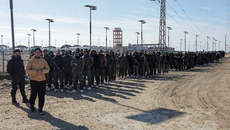Members of the Syrian government security forces gather after they took control of al-Hol camp following the withdrawal of Syrian Democratic Forces (SDF), in Hasaka, Syria, January 21, 2026. REUTERS/Khalil Ashawi/File Photo