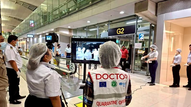 Airport health authorities wearing protective masks monitor passengers from international flights arriving at Suvarnabhumi International Airport in Bangkok, Thailand, January 25, 2026, following the implementation of health screening measures for passengers arriving from West Bengal, India, amid reports of a Nipah virus outbreak.
