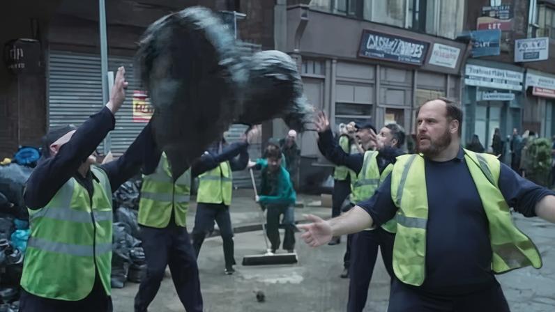 Screengrab of Coinbase advert showing men in hi-vis jackets