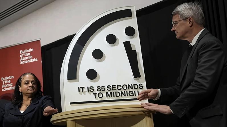 The Bulletin of the Atomic Scientists members reveal the Doomsday Clock, set to 85 seconds to midnight, during a news conference in Washington DC, on Friday.