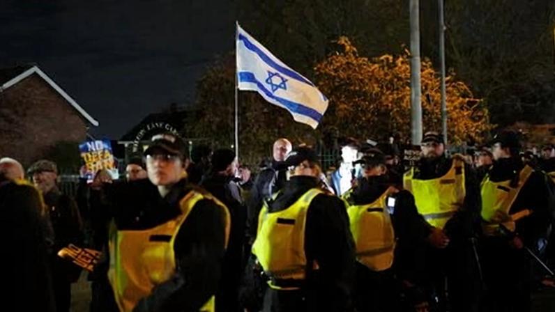 Pro-Israel supporters are led away from Villa Park by police officers before the Europa League match at Villa Park, Birmingham, in November.