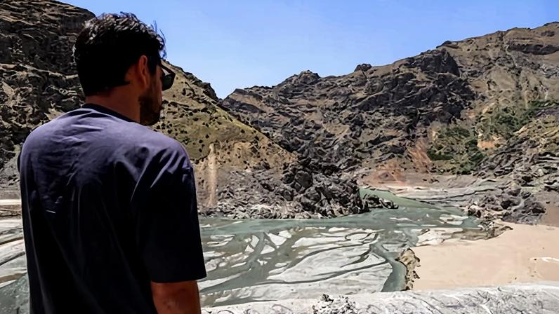 A man views the low water inlet of the river upstream of the Amir Kabir dam in Iran's northern Alborz mountain range in June last year.