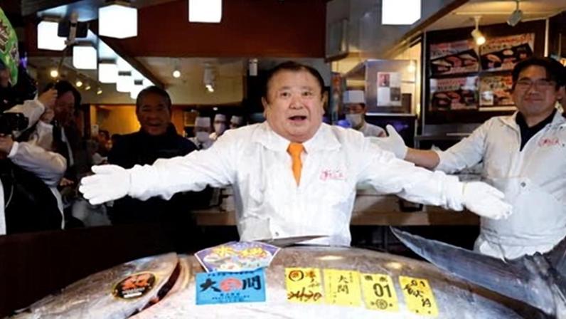 Kiyoshi Kimura, who styles himself as the ‘Tuna King’, poses with his record 510.3m yen (£2.4m) purchase at Tokyo fish market.