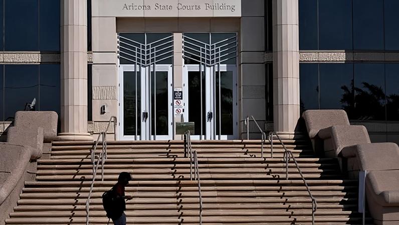 A person walks past the Arizona Supreme Court building in Phoenix on 10 April 2024.