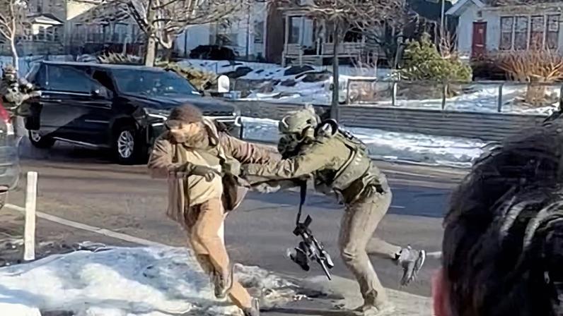 An image taken from video that shows Alex Pretti, left, scuffling with federal immigration officers in Minneapolis on 13 January, 11 days before Pretty was shot dead.