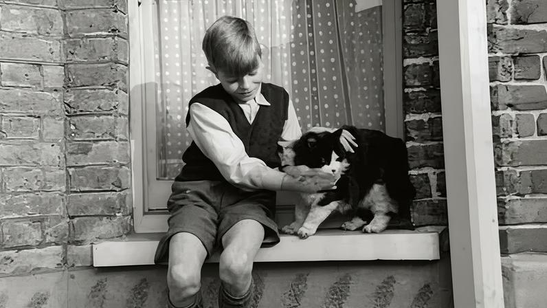 David Bowie – then Jones – with a cat at 4 Plaistow Grove around 1956.