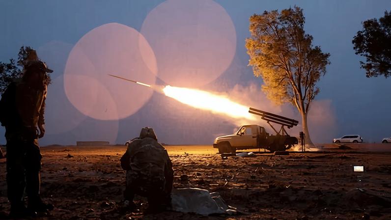 Syrian government forces launch a rocket towards Kurdish forces near Dibsi Faraj in the Tabqa area in northern Syria.
