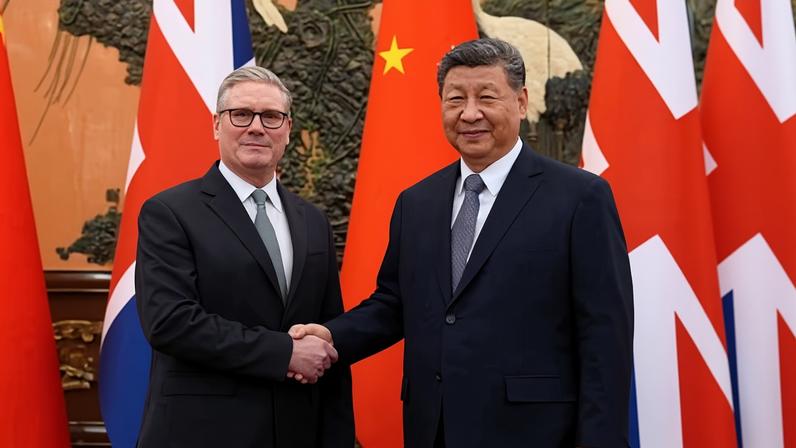 Keir Starmer shakes hands with China’s Xi Jinping ahead of a bilateral meeting.