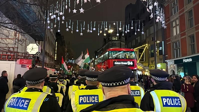 Met police officers imposing conditions on a demonstration in central London in December.