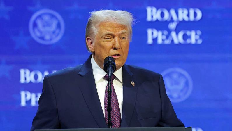 U.S. President Donald Trump takes part in a charter announcement for his Board of Peace initiative aimed at resolving global conflicts, alongside the 56th annual World Economic Forum (WEF), in Davos, Switzerland, January 22, 2026. REUTERS/Denis Balibouse