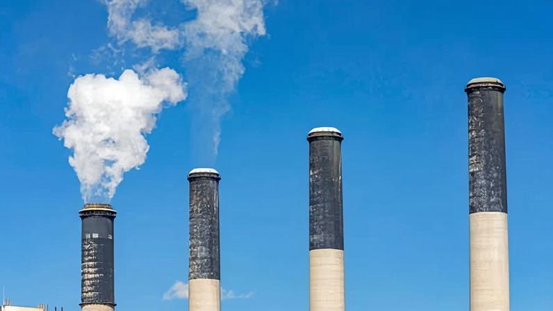 Emissions rise from smokestacks