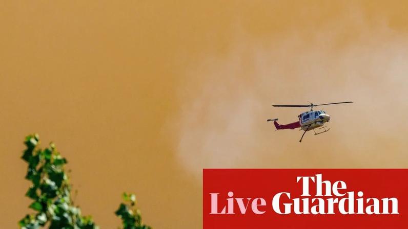 A firefighting helicopter flies through smoke above the Longwood bushfire in central Victoria earlier this month
