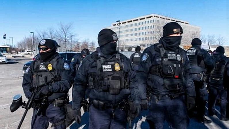 Department of Homeland Security police officers arrest a person outside of the Bishop Henry Whipple federal building on 14 January 2026 in Minneapolis, Minnesota.