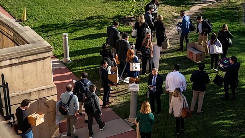 Reporters walk out together after turning in their credentials for refusing to sign new reporting limits dictated by Pete Hegseth.