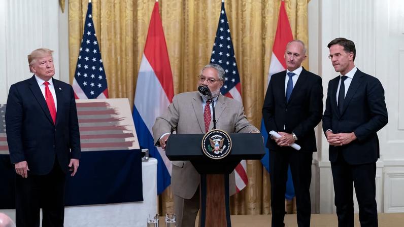 US president Donald Trump (left) looks on while Smithsonian Institution secretary Lonnie G. Bunch speaks during a 2019 ceremony at the White House