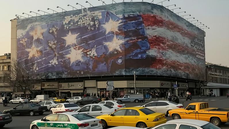 Enghelab Square, where a new billboard warns the US against military action in Iran, is used for gatherings called by the state and authorities change its mural based on national occasions.