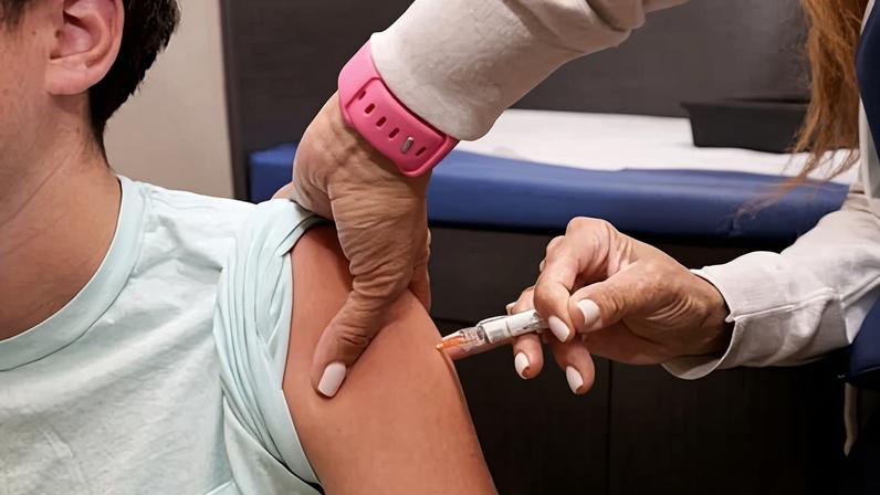 A child receives a standard immunization in Coral Gables, Florida, on 15 September 2025.