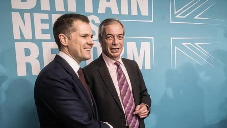 Robert Jenrick shaking hands with Nigel Farage