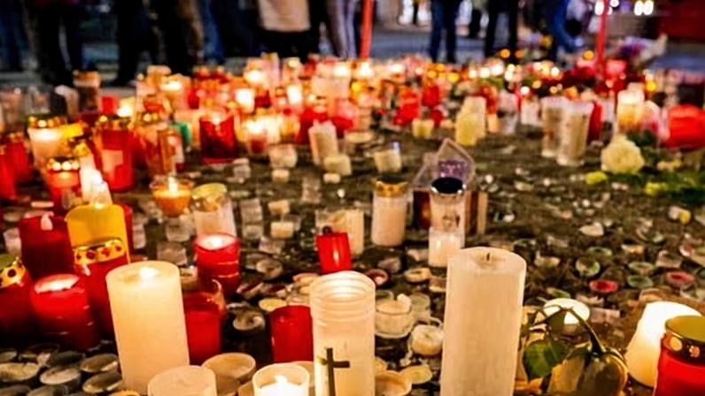 Candles left in tribute near the scene of the blaze in Crans-Montana.