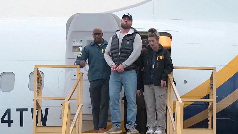 Ryan Wedding, a Canadian former Olympic snowboarder accused of becoming a cocaine smuggling kingpin linked to multiple drug-related murders, is escorted by FBI agents as he arrives handcuffed at Ontario International Airport, in California, U.S., January 23, 2026, in this screengrab taken from video.