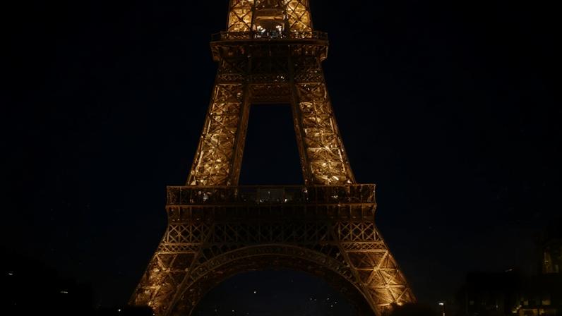 The Champ de Mars is blanketed in snow near the Eiffel Tower in Paris, France.