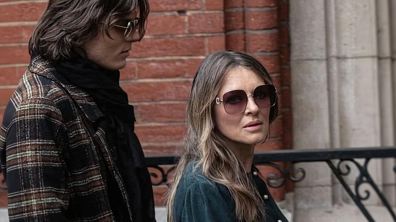 Liz Hurley arrives at the high court in London with her son, Damian. She had to compose herself several times during her appearance when she talked about wanting to protect her son.