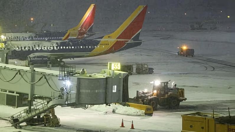 A snow removal machine working on the tarmac of LaGuardia airport in New York on Sunday.