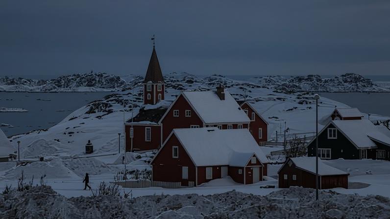 A woman walks near a church in Nuuk, Greenland, on 07 March 2025.