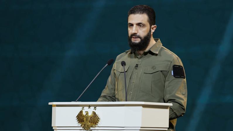 Syria's President Ahmed al-Sharaa delivers a speech on the first anniversary of Bashar al-Assad's fall