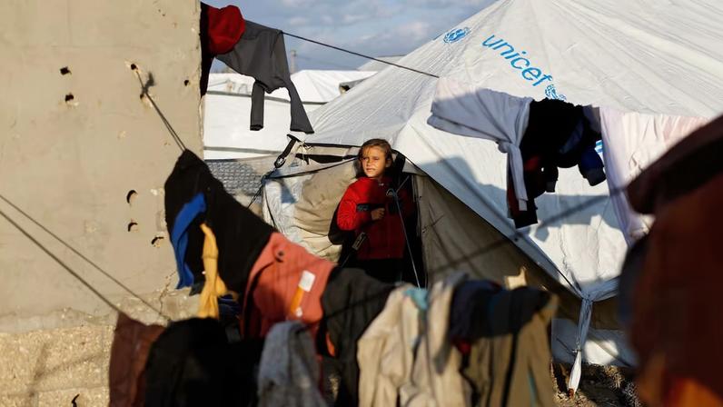 Displaced Palestinians shelter in a tent camp in Deir al-Balah
