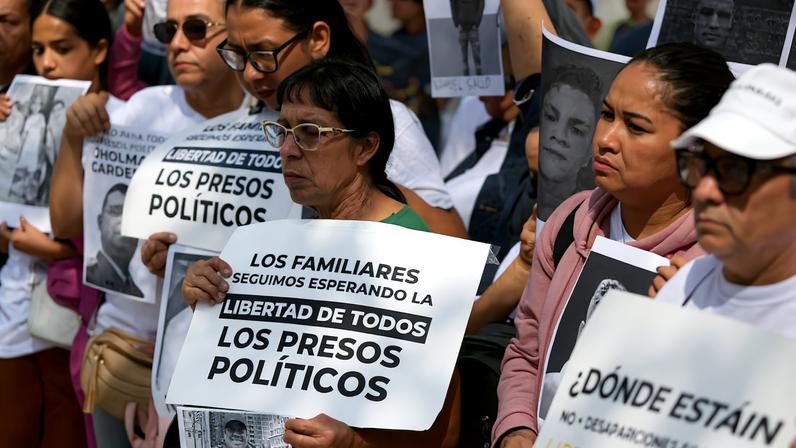 Demonstrators protest outside the Attorney General's office asking for the liberation of detained people, amid prisoner releases by the Venezuelan government, in Caracas
