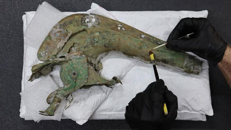 The bronze trumpet, which is shaped like a wild animal, would have been played by soldiers on the battlefield