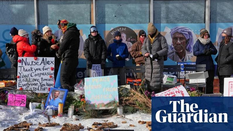 People gather near the scene where Alex Pretti was fatally shot by a US border patrol officer yesterday, in Minneapolis, on Sunday.