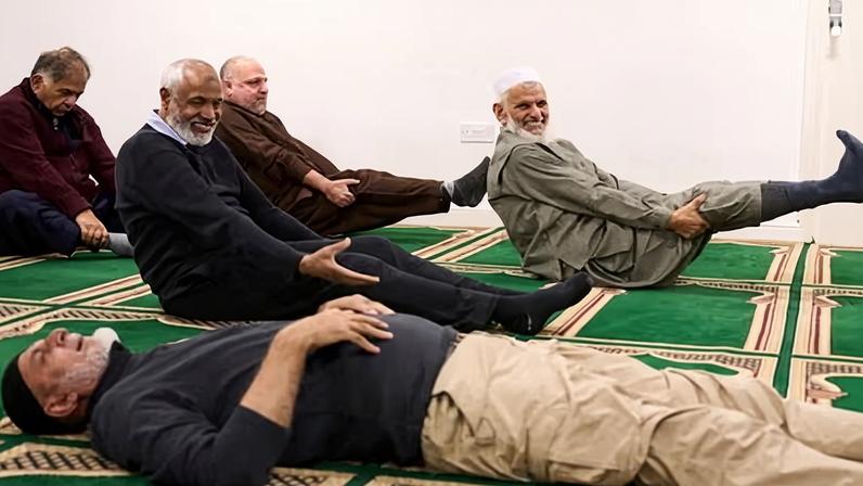 Men take part in a weekly pilates class held after midday prayers at the Jamia Usmania mosque in Heaton Village, Bradford.
