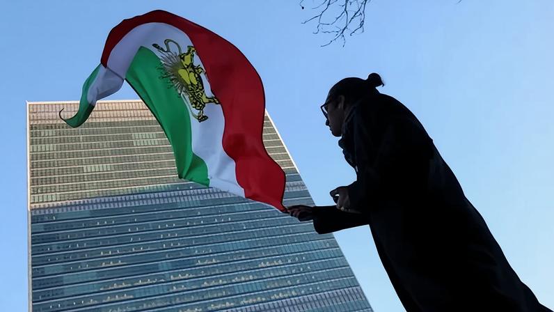 A protester waves the Iranian flag outside UN headquarters in New York.