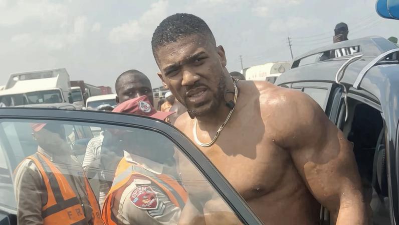 British boxer Anthony Joshua gets into an emergency responders' vehicle after being involved in a car crash, in which he sustained minor injuries and was taken to the hospital, according to police, in Ogun State, Nigeria December 29, 2025 in this screen grab obtained from social media video.
