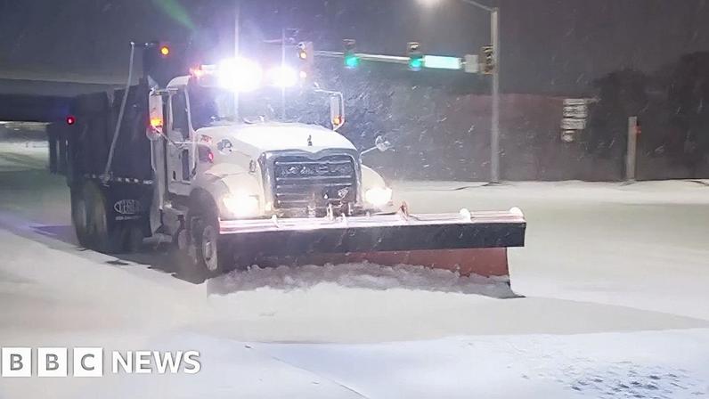 Snow plow on road