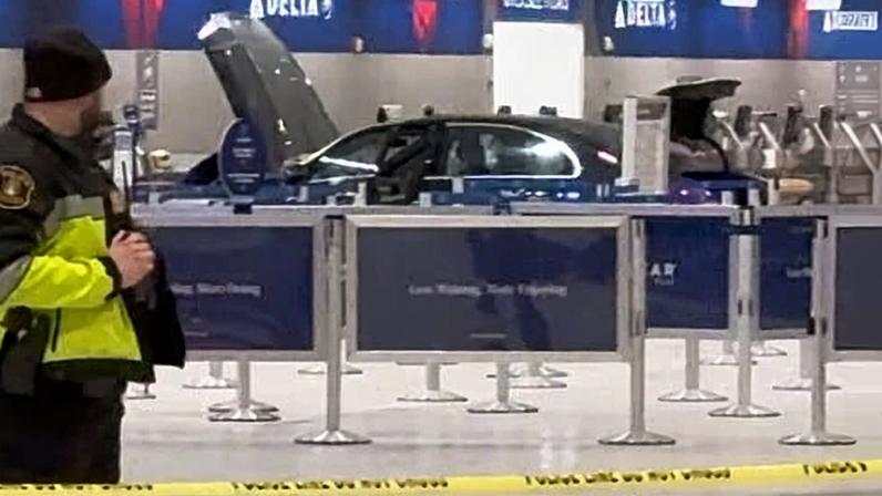The scene of the car crash at Detroit’s metropolitan Wayne county airport on 23 January 2026.