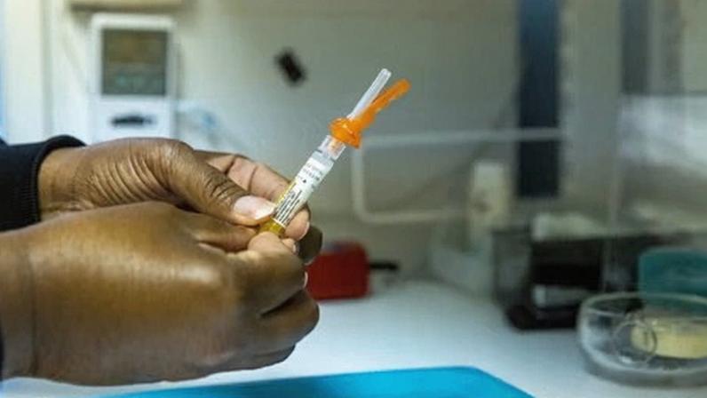 A medical professional prepares the hepatitis B vaccine.