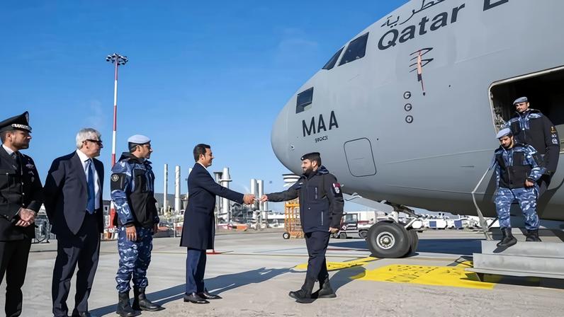 Staff walking off plane and shaking hands with people on tarmac