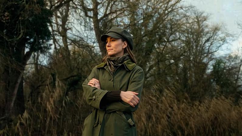 Princess of Wales wearing winter clothing in a countryside setting.