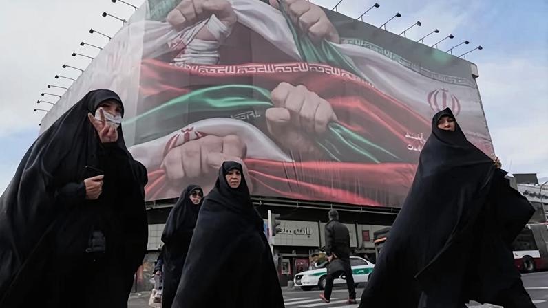Women cross a street in Tehran. US president Donald Trump said on Wednesday he had been told the killings of protesters in Iran had been halted, but added that he would ‘watch it and see’ about threatened military action.